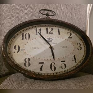 Cost Plus World Market Rustic Oval Wall Clock with Black and Brown Accents